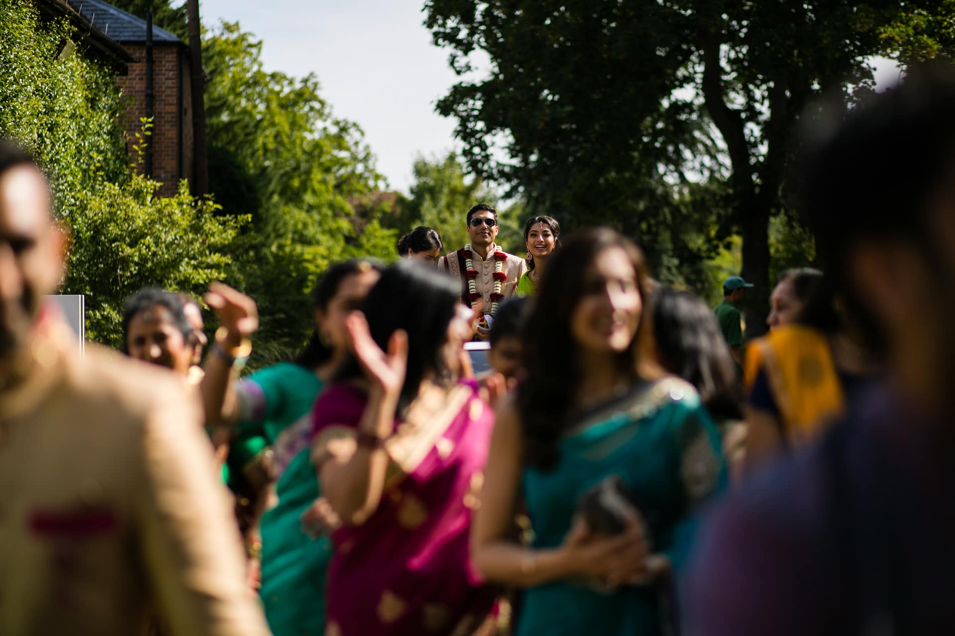 Asian wedding guests arriving for wedding ceremony