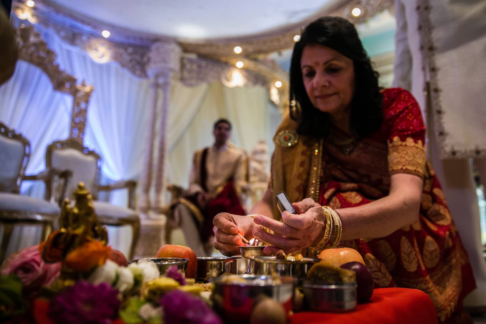 Mother of the bride lighting candle