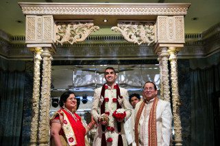 Asian Wedding bride's family welcoming groom