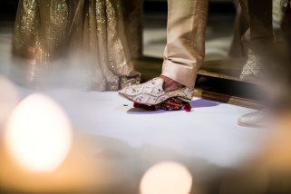 Hindu Wedding groom stepping on clay pot