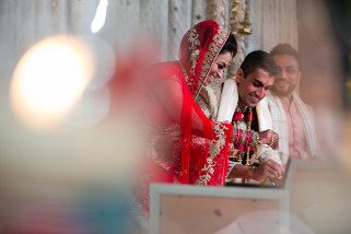 Hindu wedding couple performing Hindu wedding ceremony