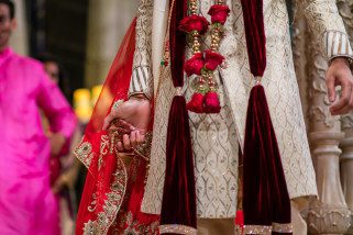 Bride and groom holding hands