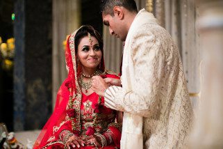 Bride smiling at groom during Indoor ceremony