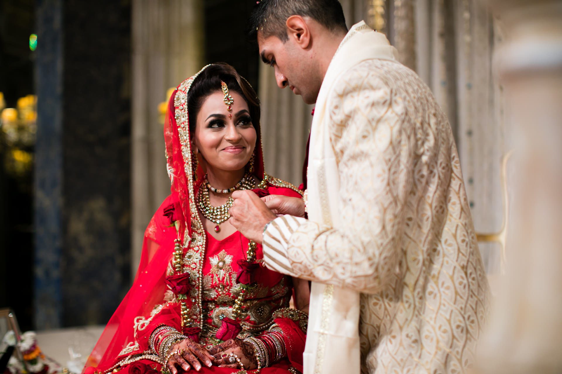 Bride smiling at groom during Indoor ceremony 