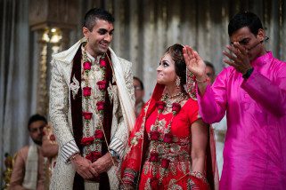 Bride and groom smiling to each other