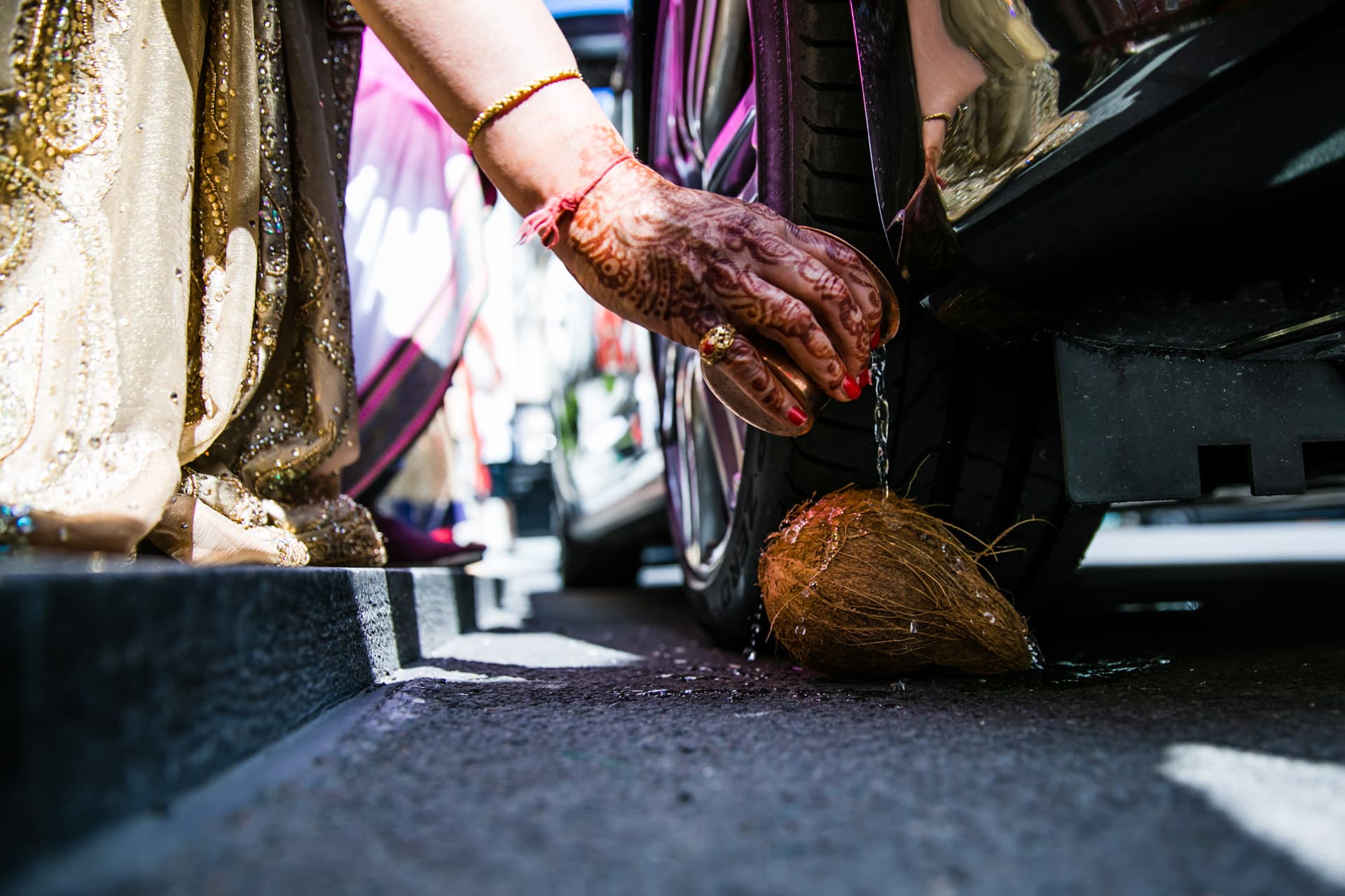 Water being poured over the coconut