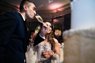 Groom sipping champagne