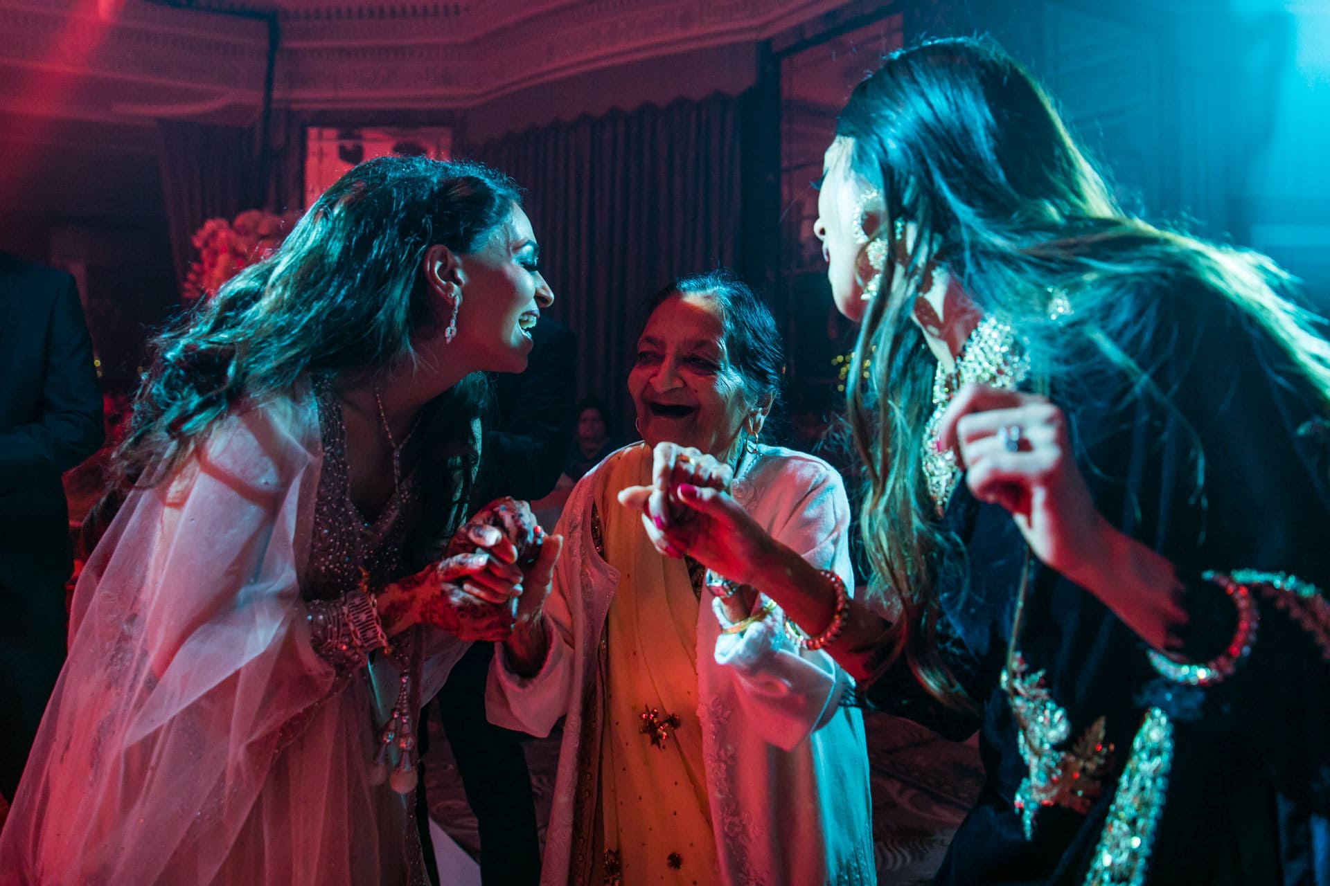 Bride dancing with the grandmother at reception party