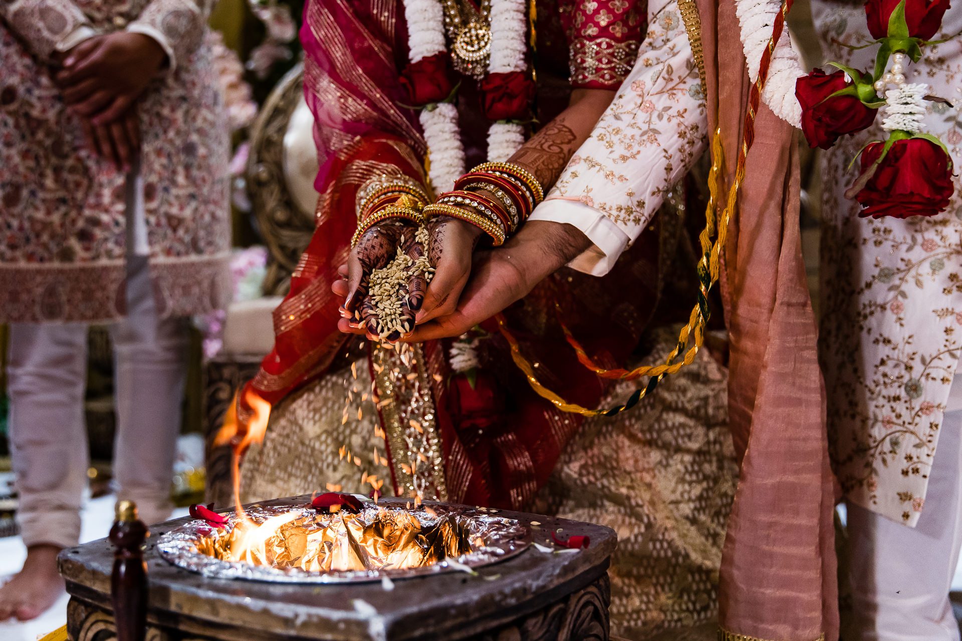 Seeds being offered into the fire during Asian wedding