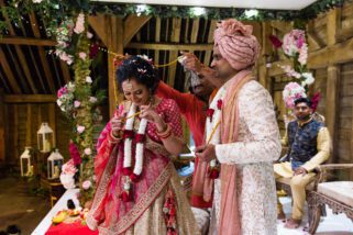 Asian bride and groom tangled up
