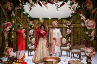 Asian bride throwing rice behind her