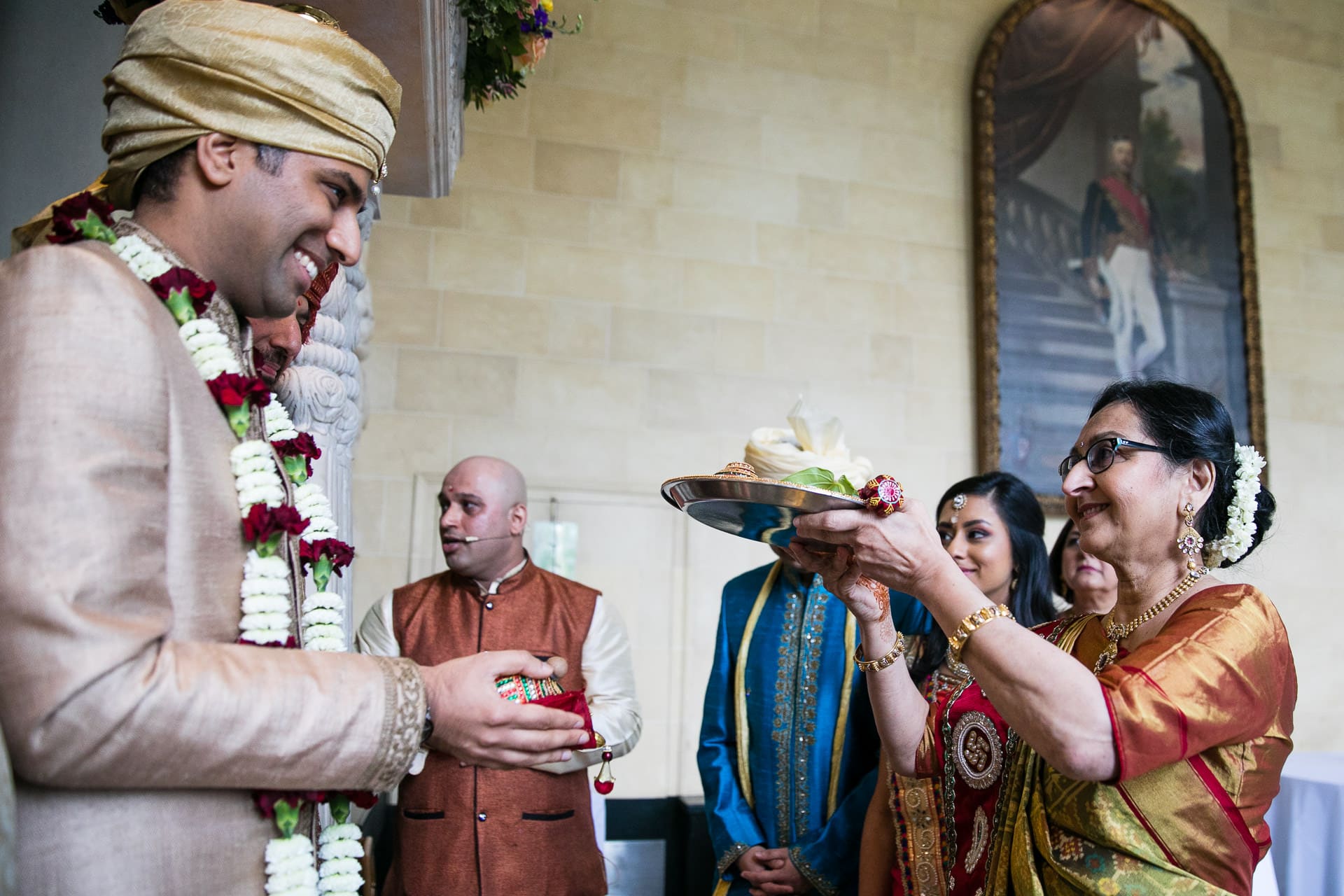 Mother of the bride performing Gujarati wedding ritual