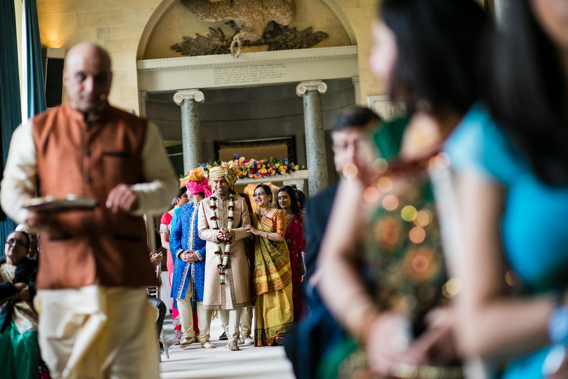 Asian Wedding groom walking to the mandap