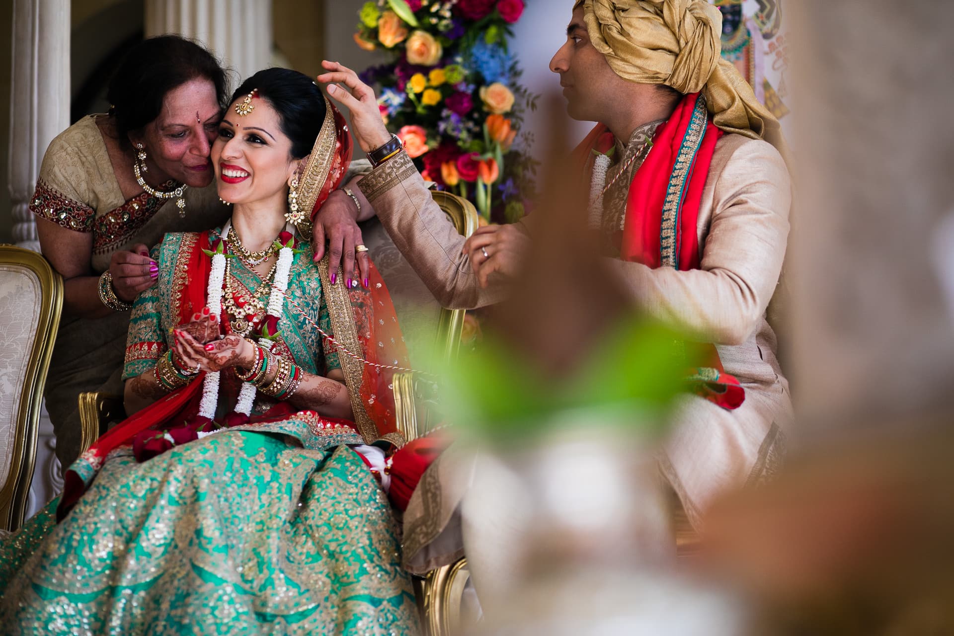 bride receiving blessings from aunty