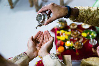 Water being poured in the hindu groom's hands