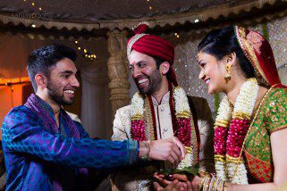 Bride and Groom laughing during Hindu Wedding ceremony