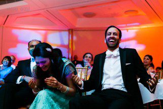 Bride and Groom laughing during speeches at reception party