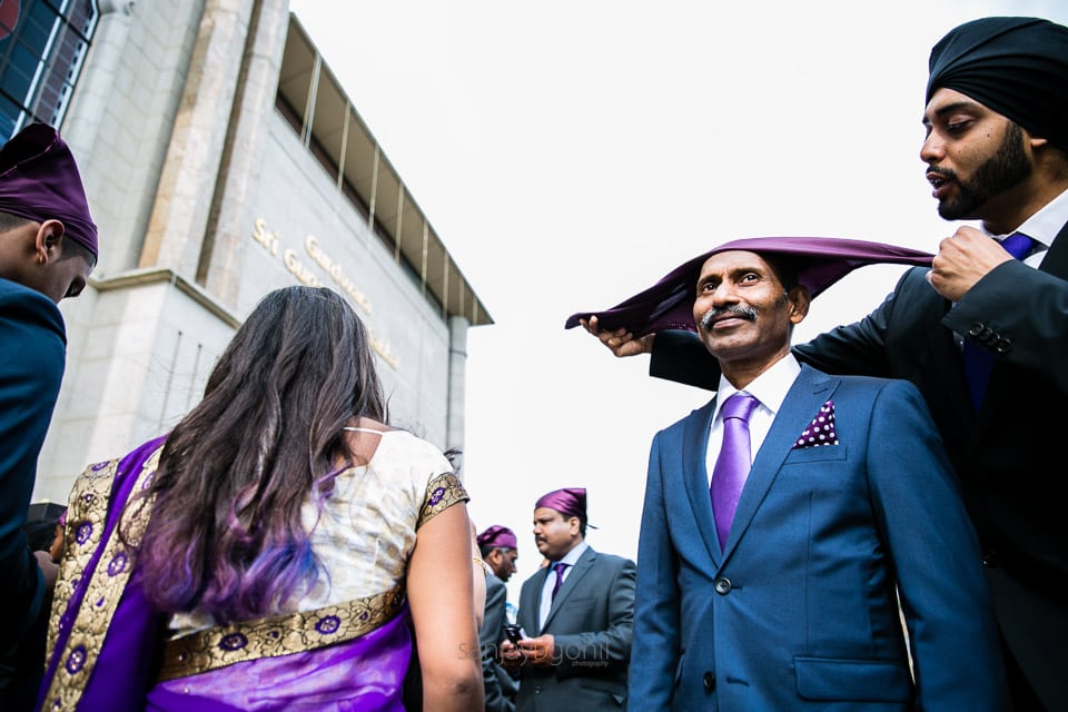 Father of bride having head covered