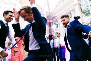 Asian Wedding guests dancing during reception party at Syon Conservatory