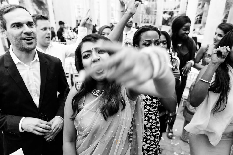 Asian Wedding guests dancing during reception party at Syon Conservatory