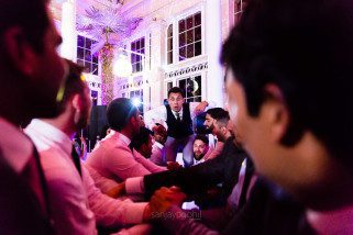 Asian Wedding guests dancing during reception party at Syon Conservatory