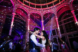 Asian Wedding guests dancing during reception party at Syon Conservatory