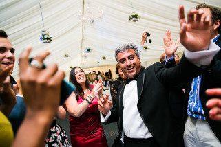 Asian wedding guests dancing