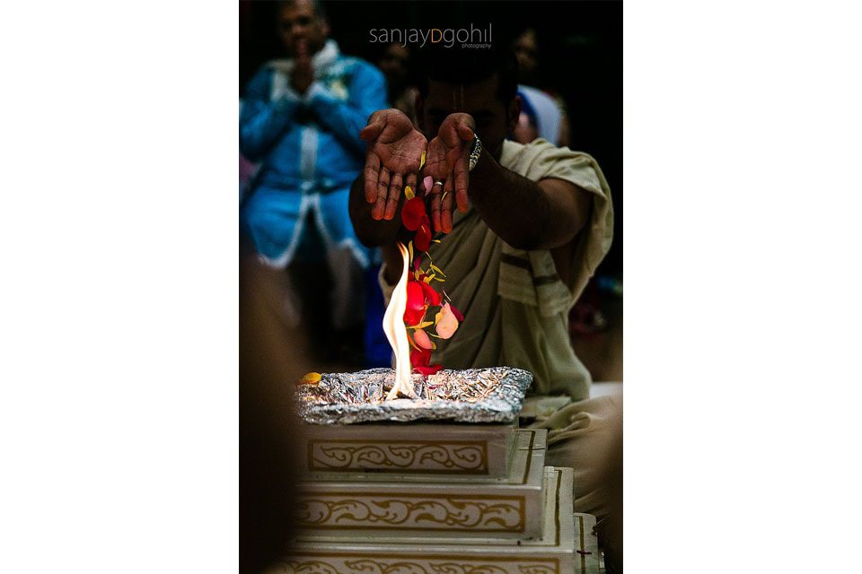 Flowers being offered to fire during the Hindu Wedding ceremony