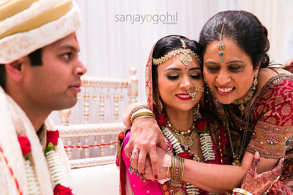 Bride and aunt hugging