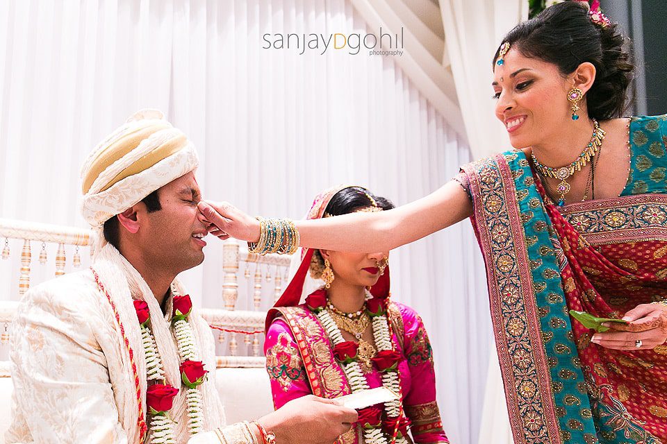 Hindu Groom's nose being pulled