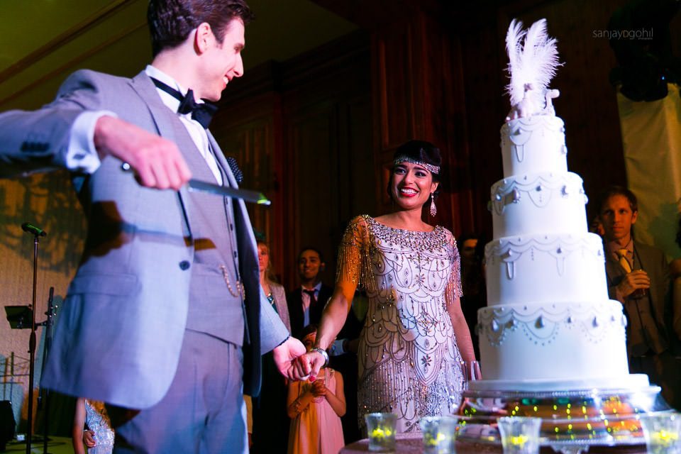 Bride and groom cutting the cake