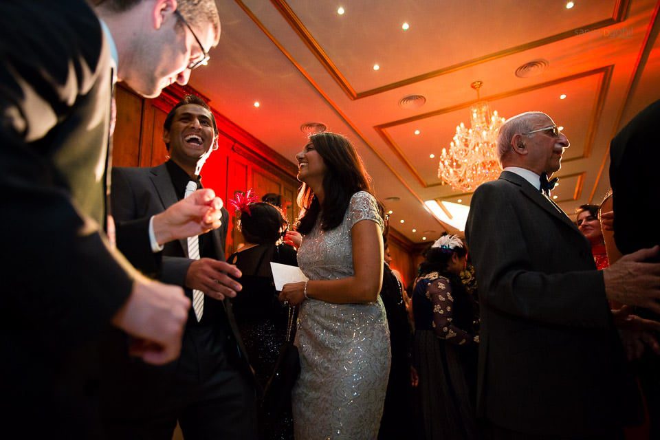 Wedding guests dancing during reception party at Hedsor House