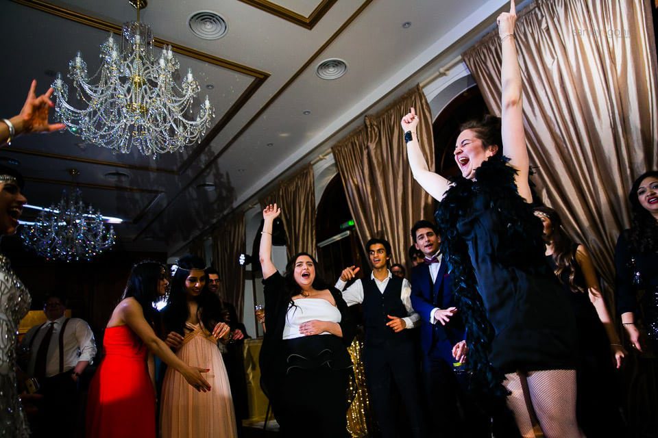 Wedding guests dancing during reception party at Hedsor House