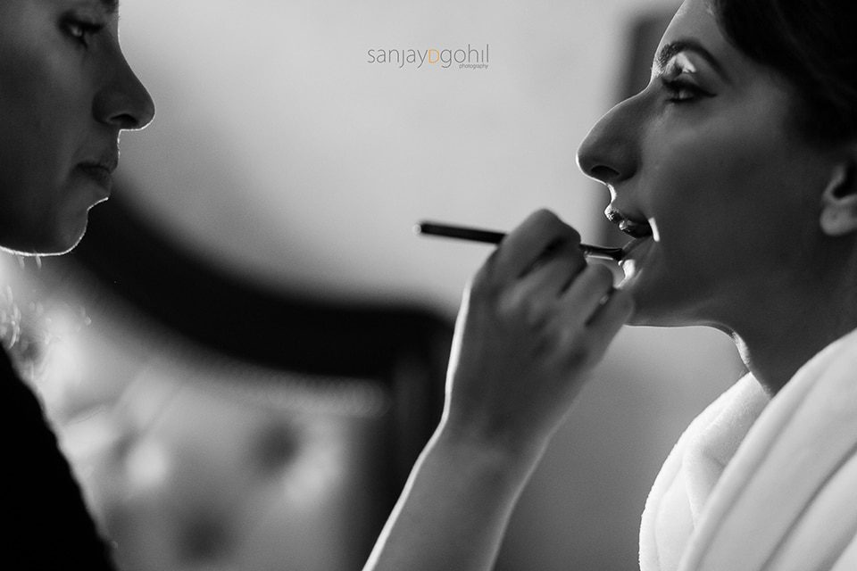 Closeup of asian wedding bride getting ready