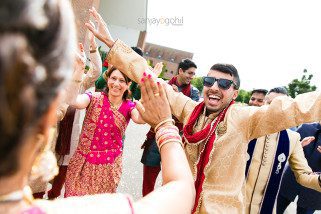 Dancing during asian wedding groom arrival