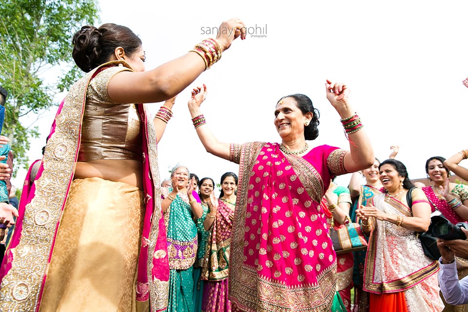 Dancing during asian wedding groom arrival