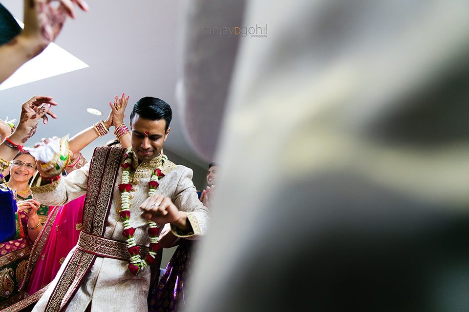 Hindu wedding groom dancing