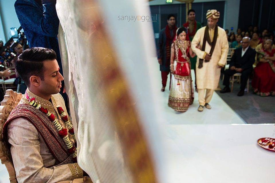 gujarati wedding bride arriving in Mandap