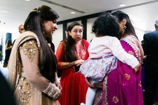 Bride and groom entering reception party