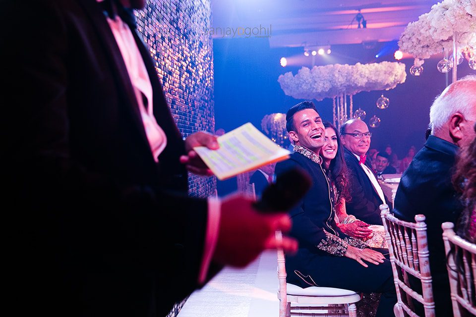 Groom laughing during wedding speech