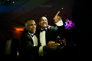 Asian wedding guests dancing