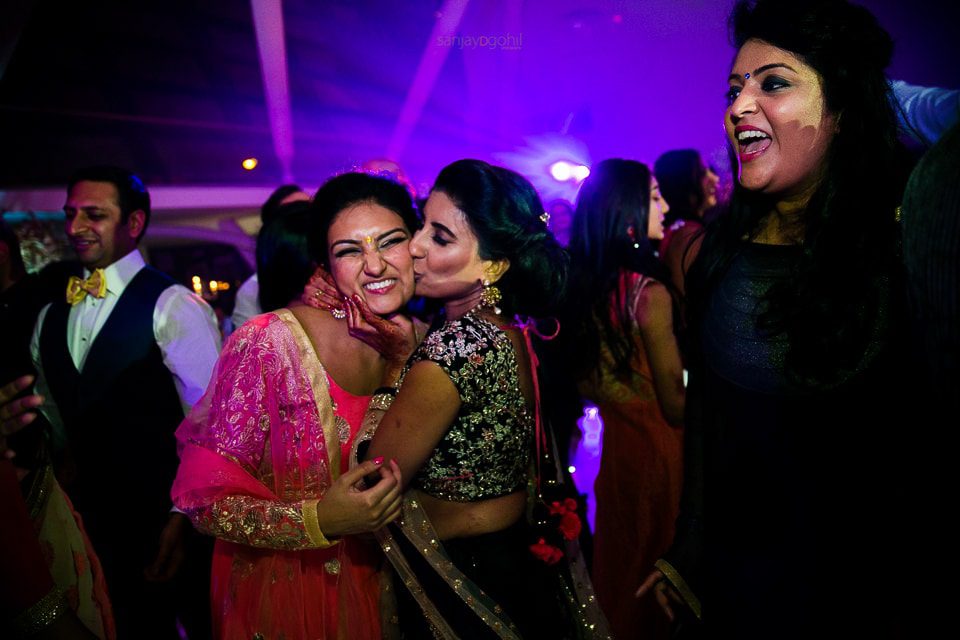 Wedding guests dancing during reception party at Sattavis Patidar centre