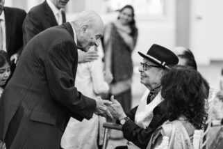 Asian wedding guests shaking hands