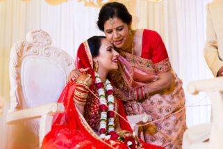 Mother and bride hugging