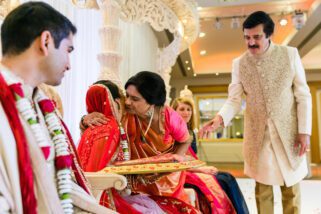 Mother of the groom blessing bride