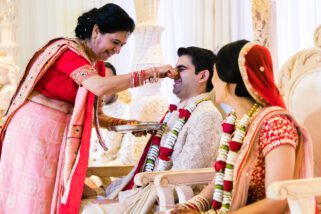 Groom's nose being pinched