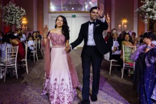 bride and groom Walking into reception party at Meridian grand