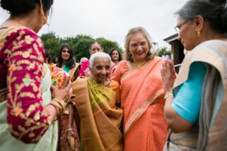 Asian wedding guests arriving at Oshwal centre