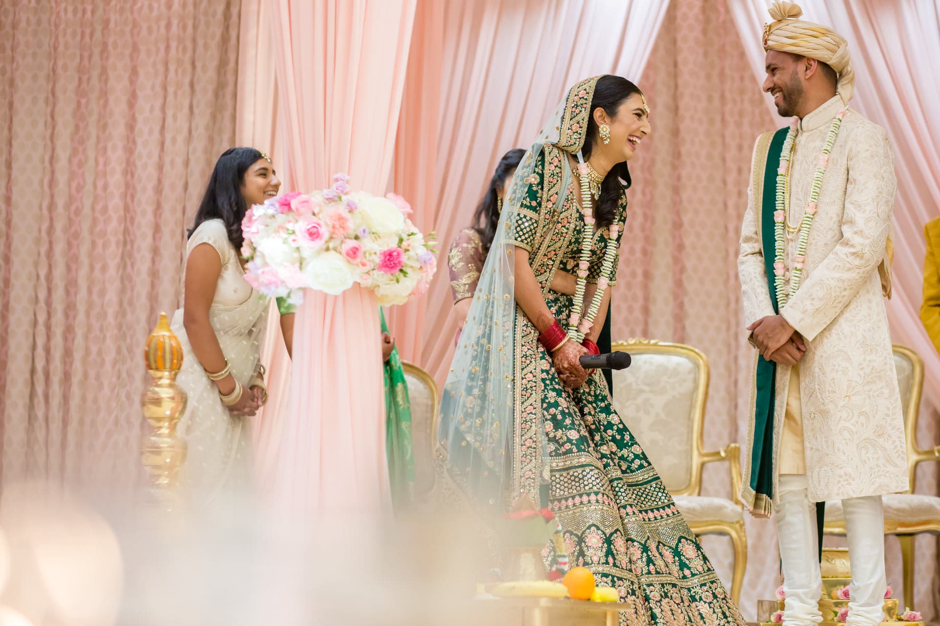 Bride and groom laughing at Hindu wedding