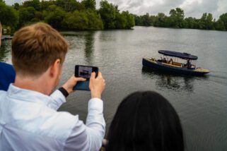 Bride and groom arriving by boat